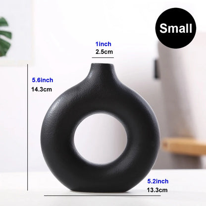 Nordic hollow donut ceramic vase angled top-down view showing central ring opening