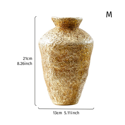 Overhead view of antique gold earthenware jar vase showing wide-open decorative top