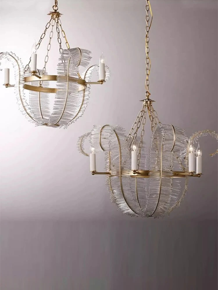 Clear crystal feathers fanning from a polished steel chandelier