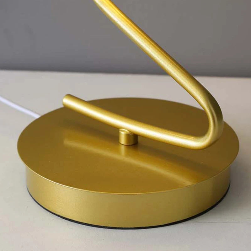 Butterfly LED table lamp illuminated in bedroom setting warm ambient glow