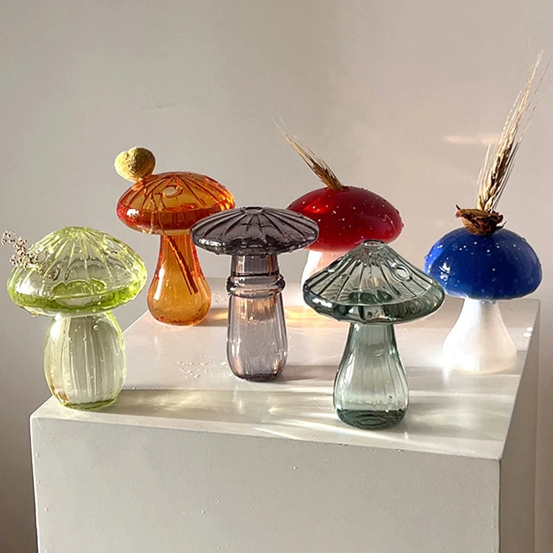 Mushroom glass vase with flower arrangement on office desk