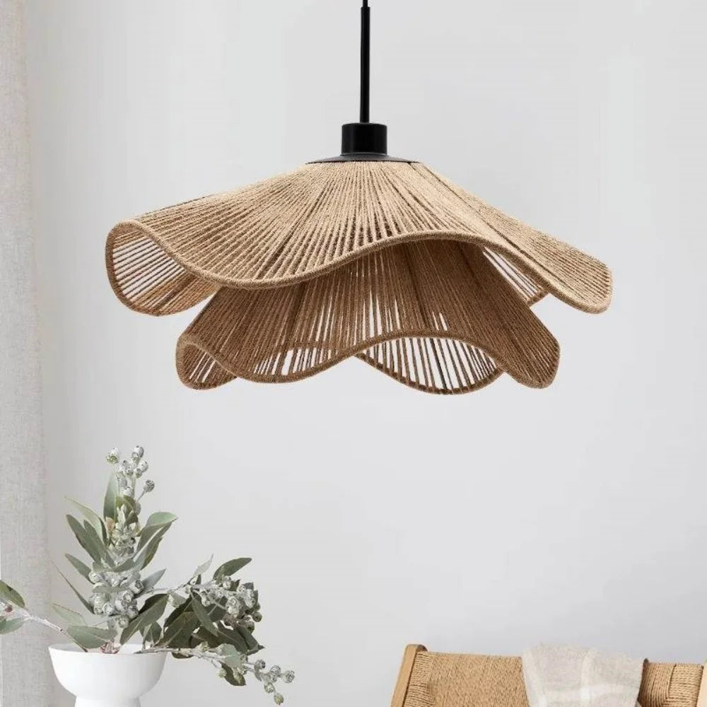 Woven hemp rope chandelier with a coiled flower shaped shade on a metal frame