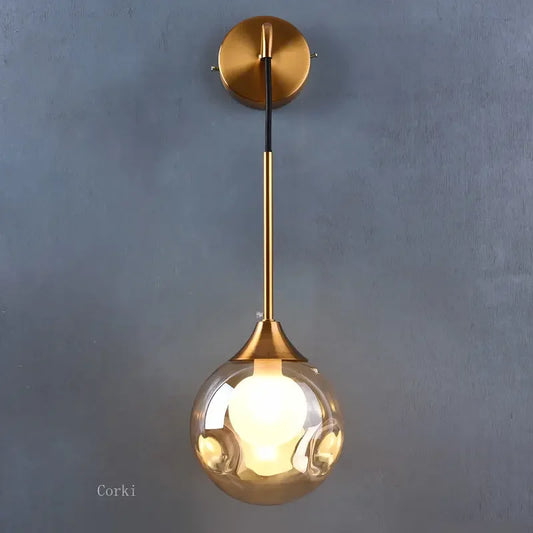 gold glass wall sconce, front view on white background