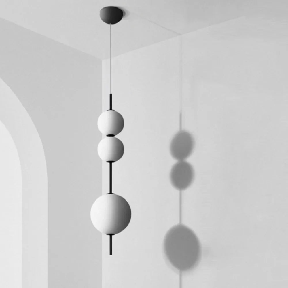 Opal glass globe chandelier on a painted white metal frame