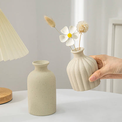 Ceramic dried flower vase ornament on wooden console table