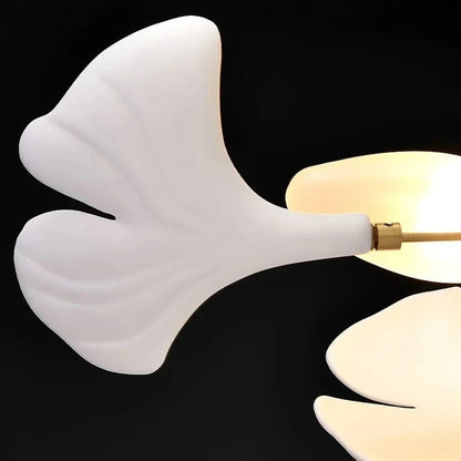 Silver bodied ginkgo chandelier with ceramic leaves and up and down light spread