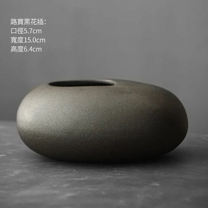 Style K terracotta vase with bulbous base and elongated neck detail