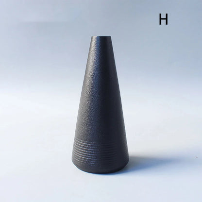 Collection of style 02-variants Japanese ceramic vases displayed together