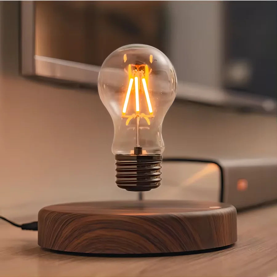 Magnetic levitation glass bulb table lamp floating above square base front view
