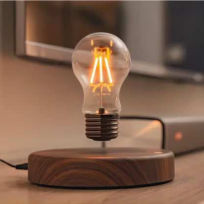 Magnetic levitation glass bulb table lamp floating above square base front view