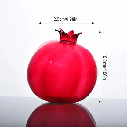 Four glass fruit-shaped bud vases in a row showing all style options
