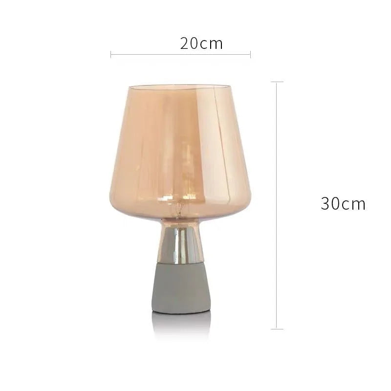 Dark gray glass lamp in EU plug variant on study side table