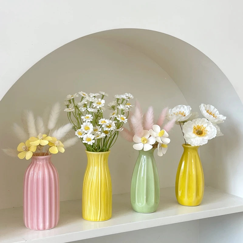 Mini ceramic bud vase on wedding table centerpiece display