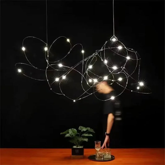 Nordic star flock chandelier with metal stars across a gold disc frame