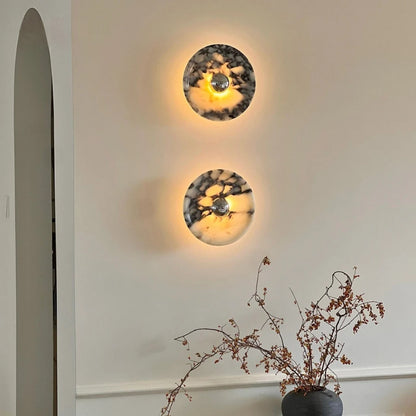 marble wall sconce, installed in a room interior setting