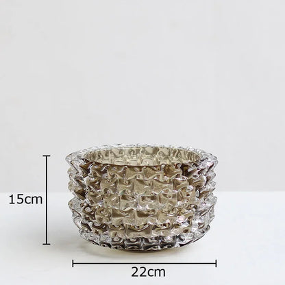 Wrinkled glass decorative vase on marble console table
