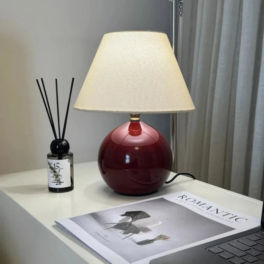 French minimalist designer table lamp warm light on bedroom nightstand