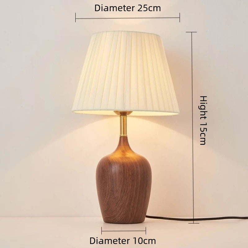 Close-up of walnut lamp base socket and power cord connection detail