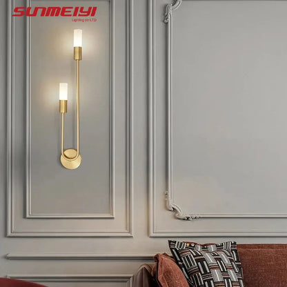 gold wall sconce, installed in a room interior setting