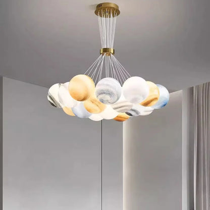 Acrylic chandelier at 29.5 in diameter with nineteen lit heads