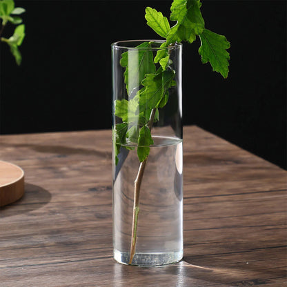 Tall glass cylinder vase 6.5x12 cm with pampas grass arrangement on side table