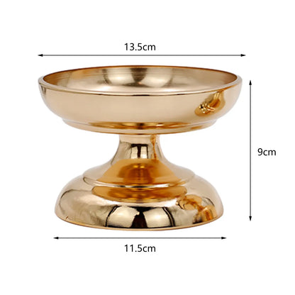 Gold metal flower vase stand arranged with white roses for ceremony backdrop