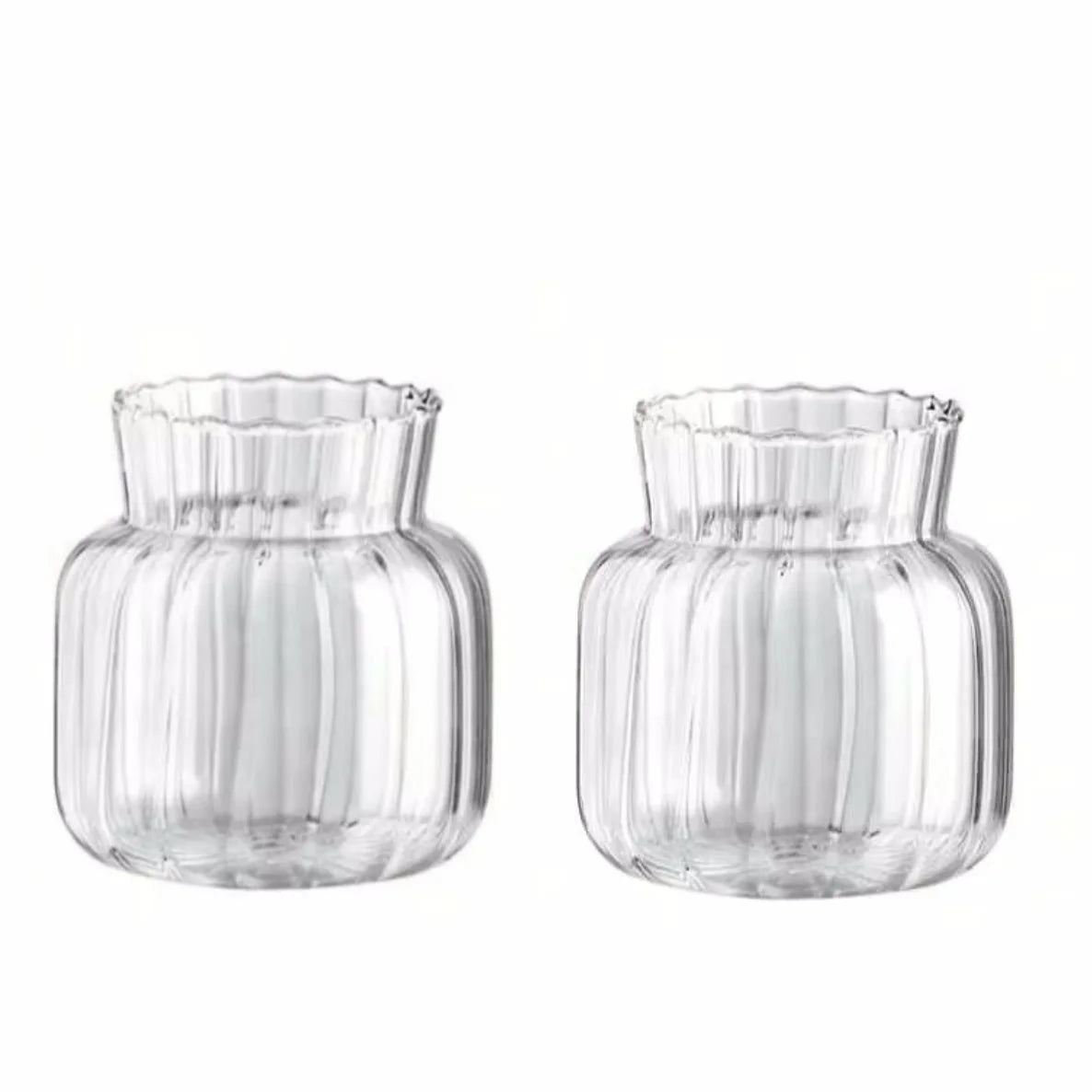 Overhead view of retro striped mini glass vase with fresh stems