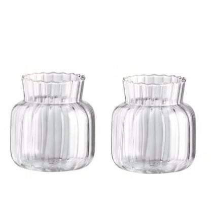 Overhead view of retro striped mini glass vase with fresh stems