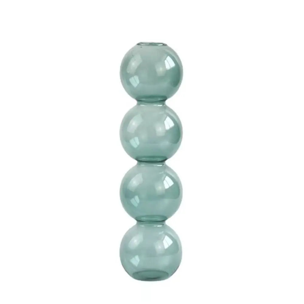 Romantic pink and blue glass vases in couples theme arrangement with decorative accents