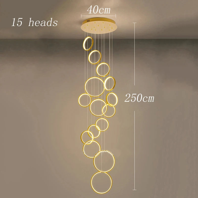 Gold iron chandelier frame carrying diffused acrylic heads