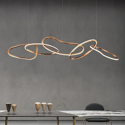 Rose gold circle chandelier with brushed steel discs on a flush plate
