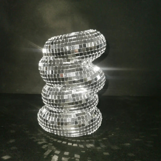 Silver mirrored glass disco ball vase on home shelf centerpiece