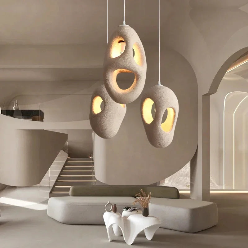 Wabi sabi resin chandelier with a tapered matte shade on a slim cord