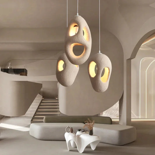 Wabi sabi resin chandelier with a tapered matte shade on a slim cord