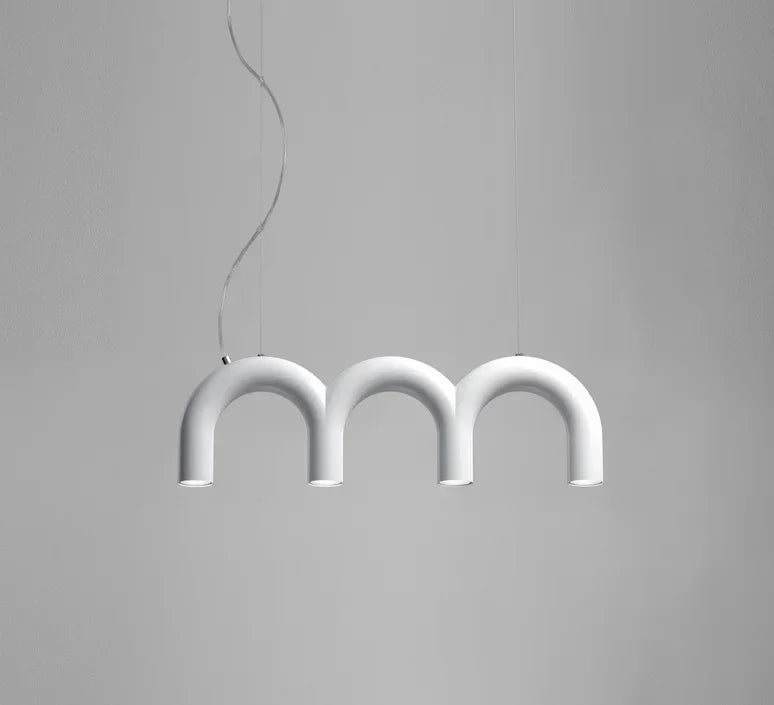 Long arched tube chandelier shown with its twin cord suspension