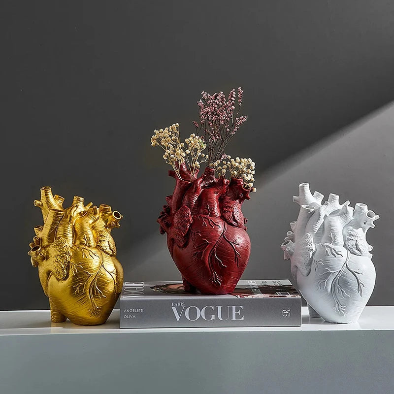 Heart-shaped resin vase in four color options side by side