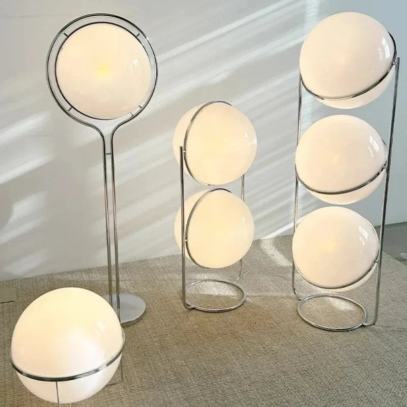 Chrome floor lamp white lampshade variant in modern living room setting