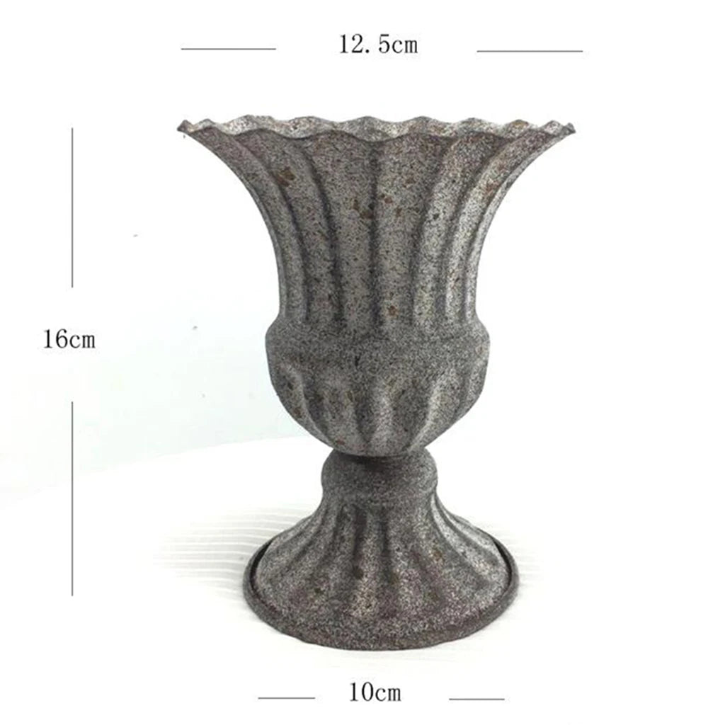 Close-up of white metal vase base showing weight and stability detail