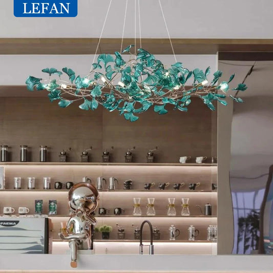 Acrylic leaf linear chandelier with green shades on a forged bar