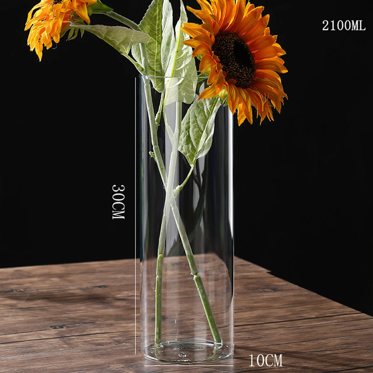 Medium glass cylinder vase 5.5x15 cm holding fresh white peony stems on table