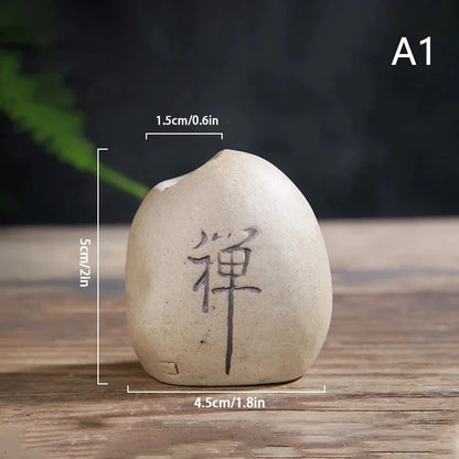 Stone-look ceramic Zen vase A5 in warm terracotta tone on bamboo mat surface