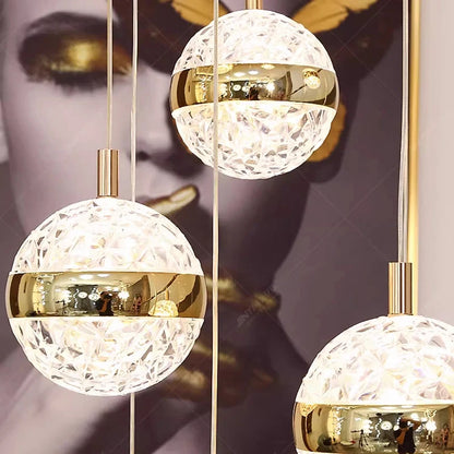 Cascade stair chandelier lit in warm white down an open stairwell