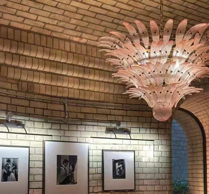 Clear glass chandelier shades lit by G9 LED bulbs in warm light