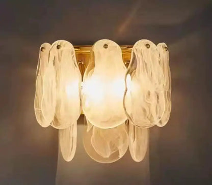 Multilayer lantern chandelier lit in cold white with downward glow