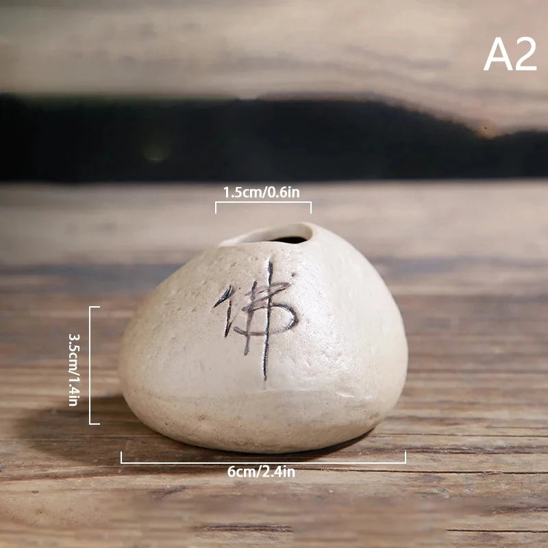 Collection of six Zen stone mini ceramic vases in varied earth tones on styled display