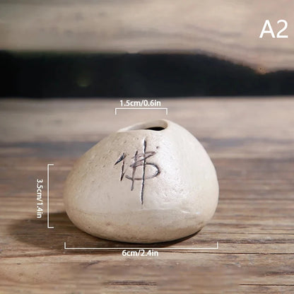 Collection of six Zen stone mini ceramic vases in varied earth tones on styled display