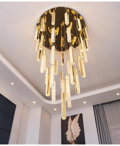 Gold plated spiral crystal chandelier with a long cascading column