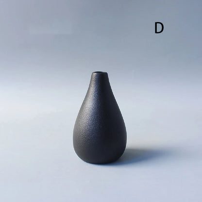 Close-up of matte black ceramic texture on Japanese wabi-sabi style bud vase