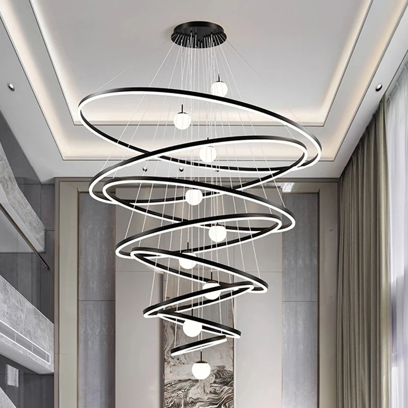 Lit ring detail on an iron and aluminum stacked chandelier in black