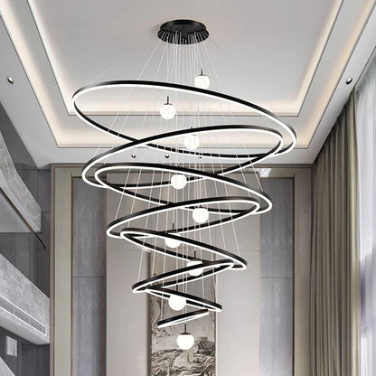 Lit ring detail on an iron and aluminum stacked chandelier in black